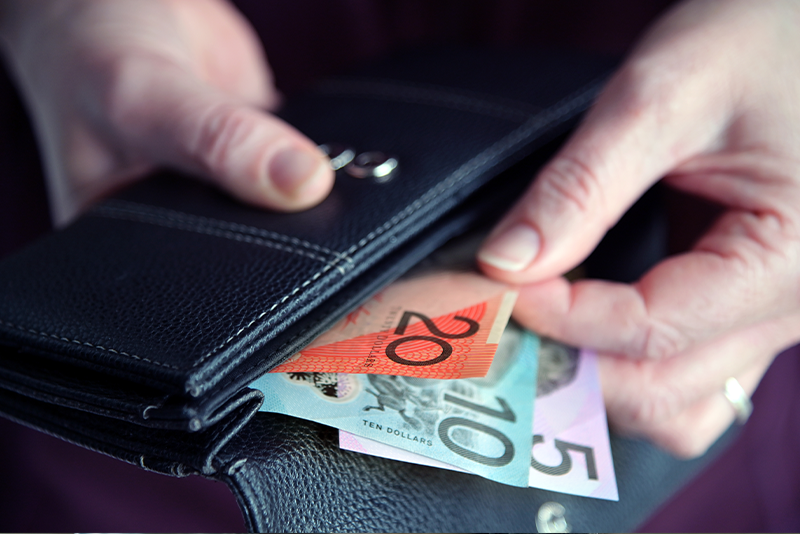 Should You Switch Internet Providers? Pros and Cons Explained 11 hand pulling out Australian money from a wallet