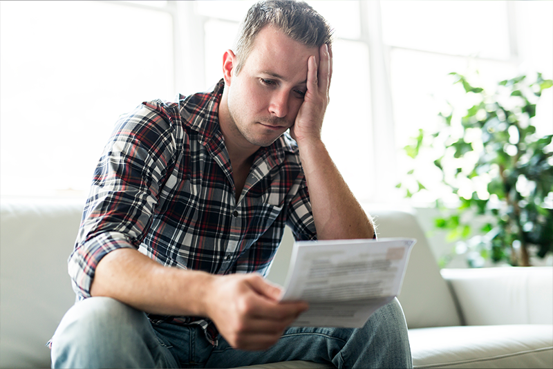 Should You Switch Internet Providers? Pros and Cons Explained 10 man holding some documents on sofa